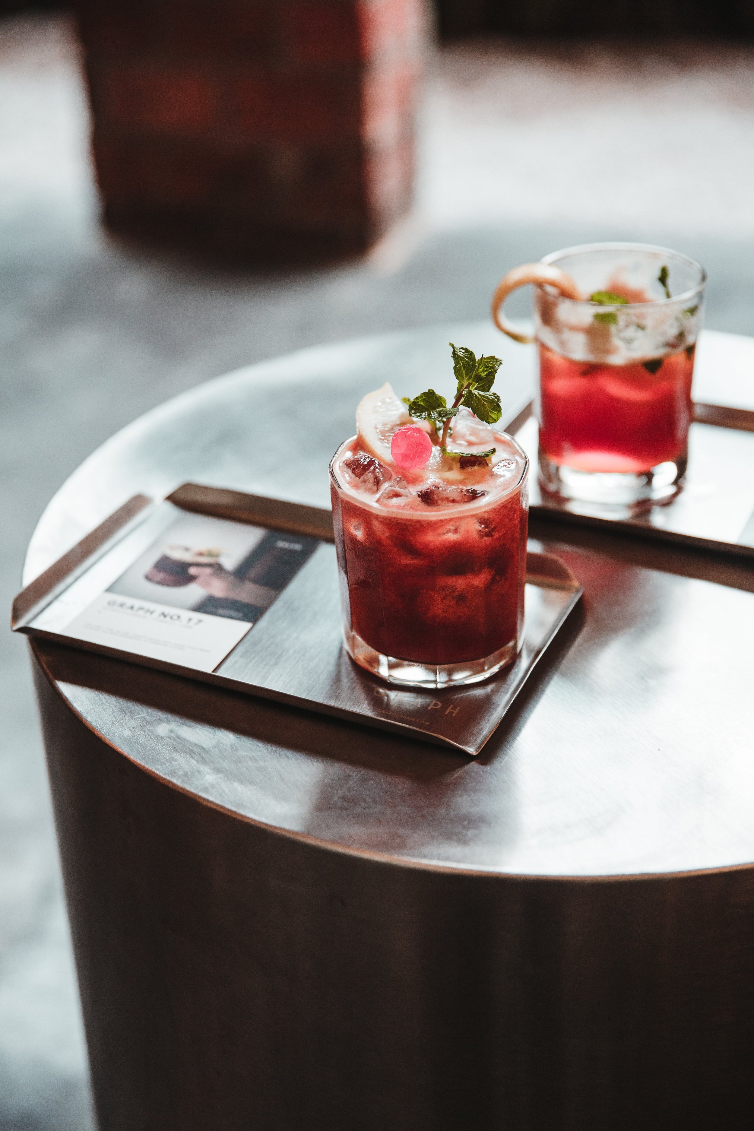 Two cocktails on a tray
